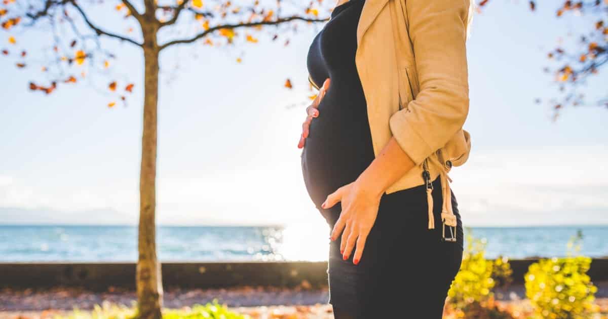 https://www.pexels.com/photo/pregnant-woman-wearing-beige-long-sleeve-shirt-standing-near-brown-tree-at-daytime-132730/